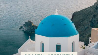 A blue-domed Santorini church above the deep blue Aegean sea, the classic Greek island coastal aesthetic.