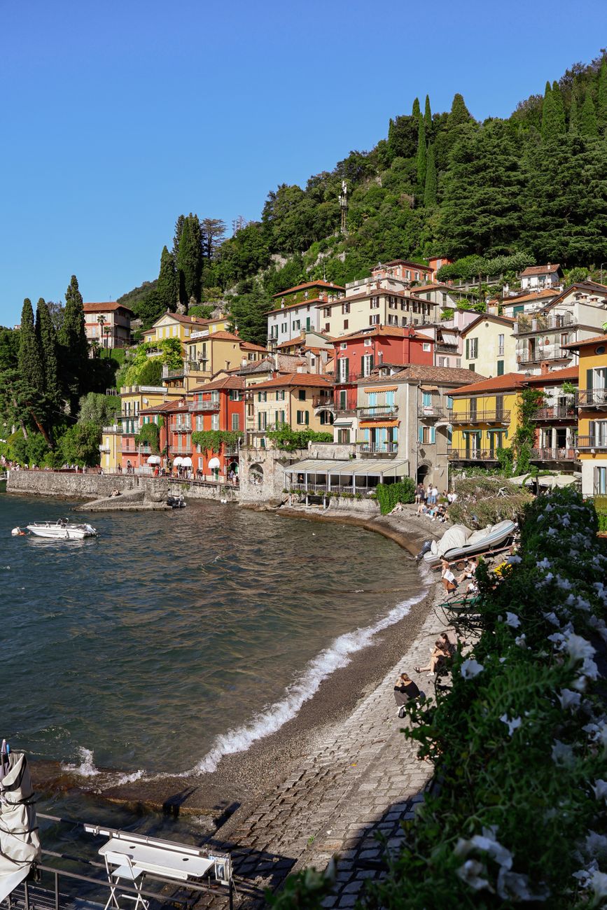 Varenna, Lake Como — colourful houses cascading to the calm water with green mountains behind