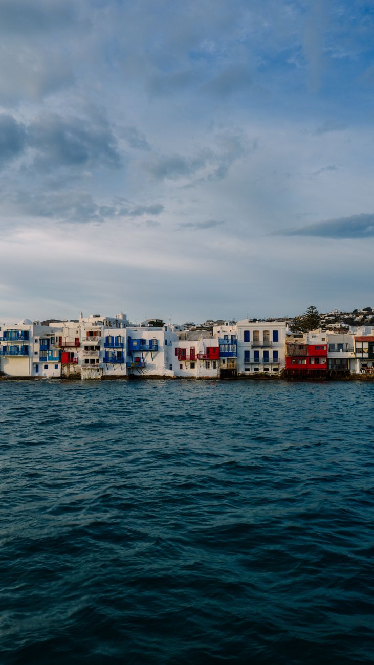 Mykonos Little Venice — colourful waterfront houses with balconies over the turquoise sea